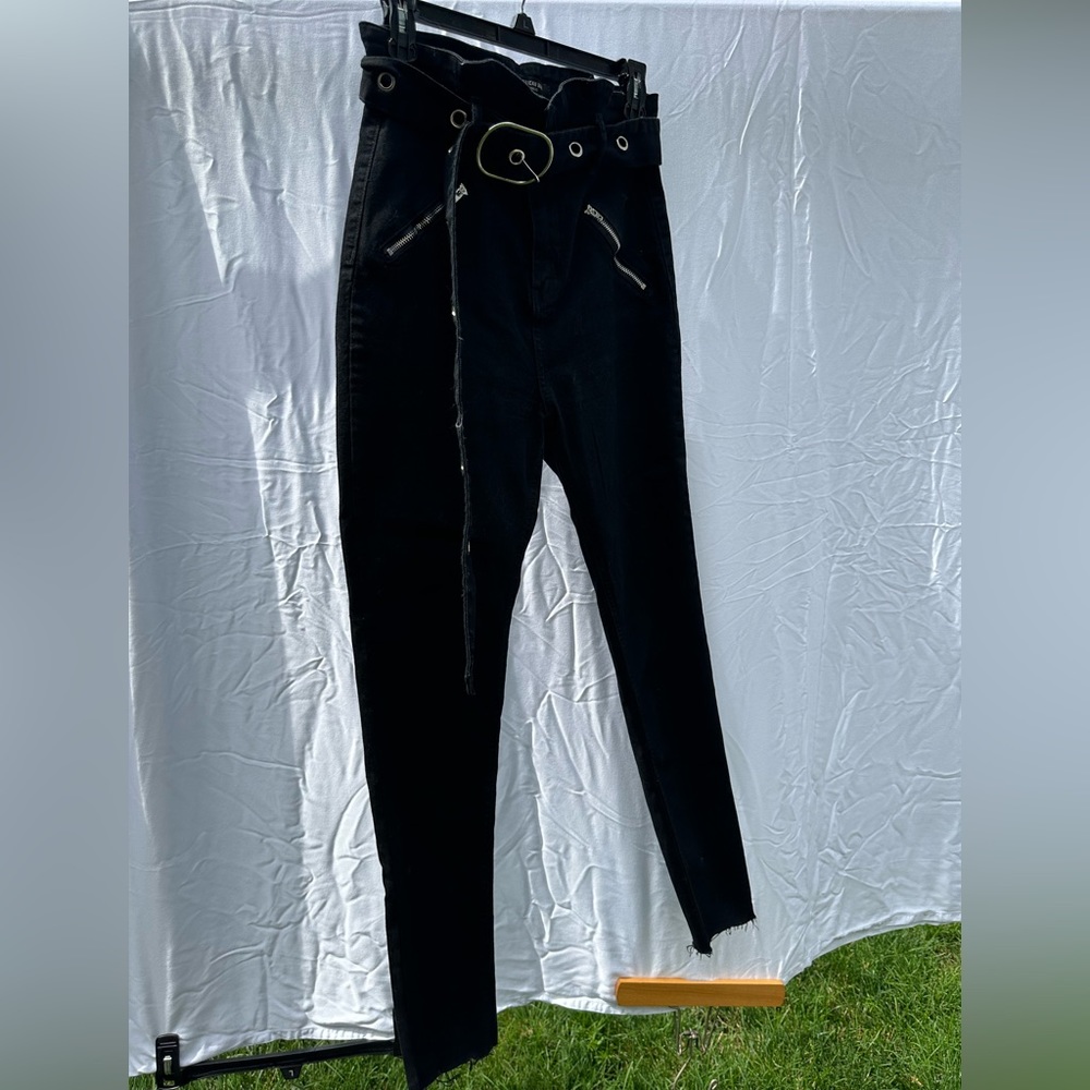 Womens very high waisted pants with belt.